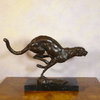 Bronze statue of a cheetah at full speed